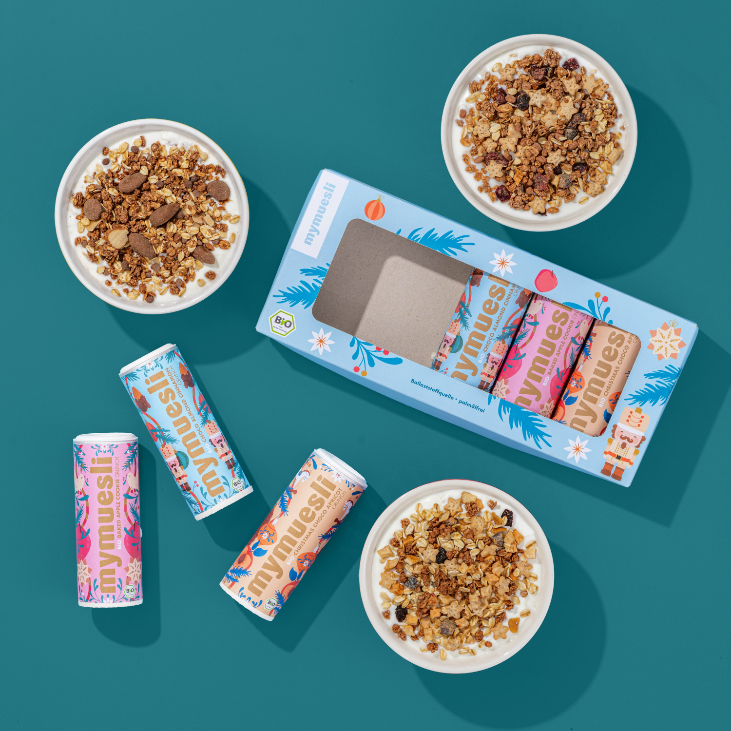 Abbildung der drei weihnachts Mini Müslis in Schale und in der Mitte das Set